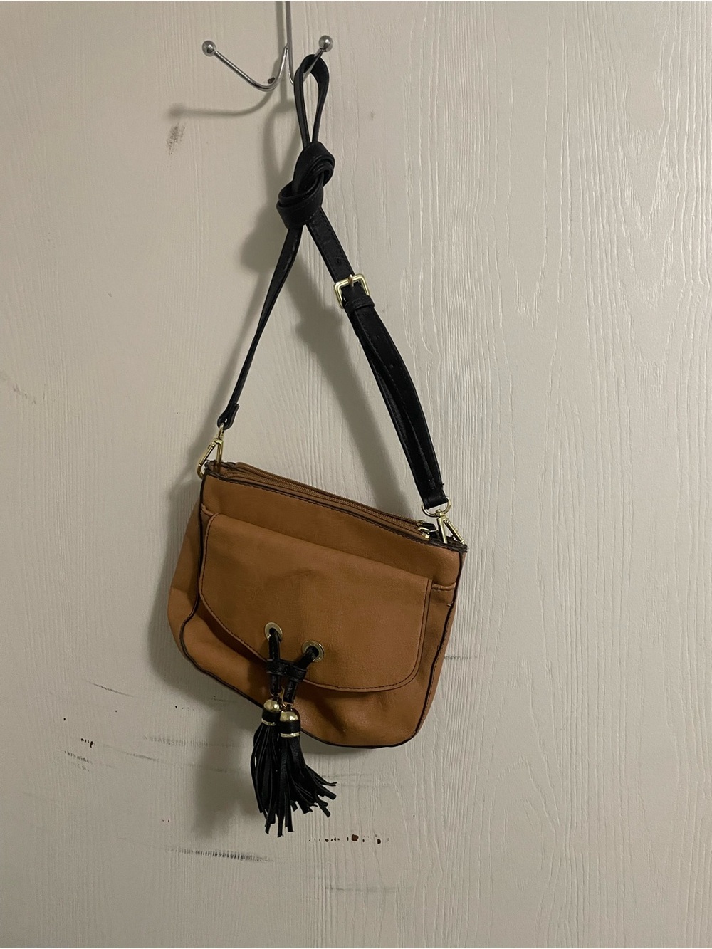 Liz Clairborne Tan Crossbody Bag with Black Strap and Tassel Accent